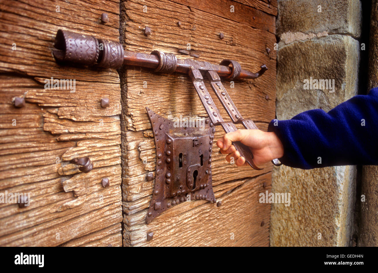 medieval lock in front door of `La Assumpció´ church.Romanesque church.Coll.Boí valley.Lleida province. Catalonia. Spain Stock Photo